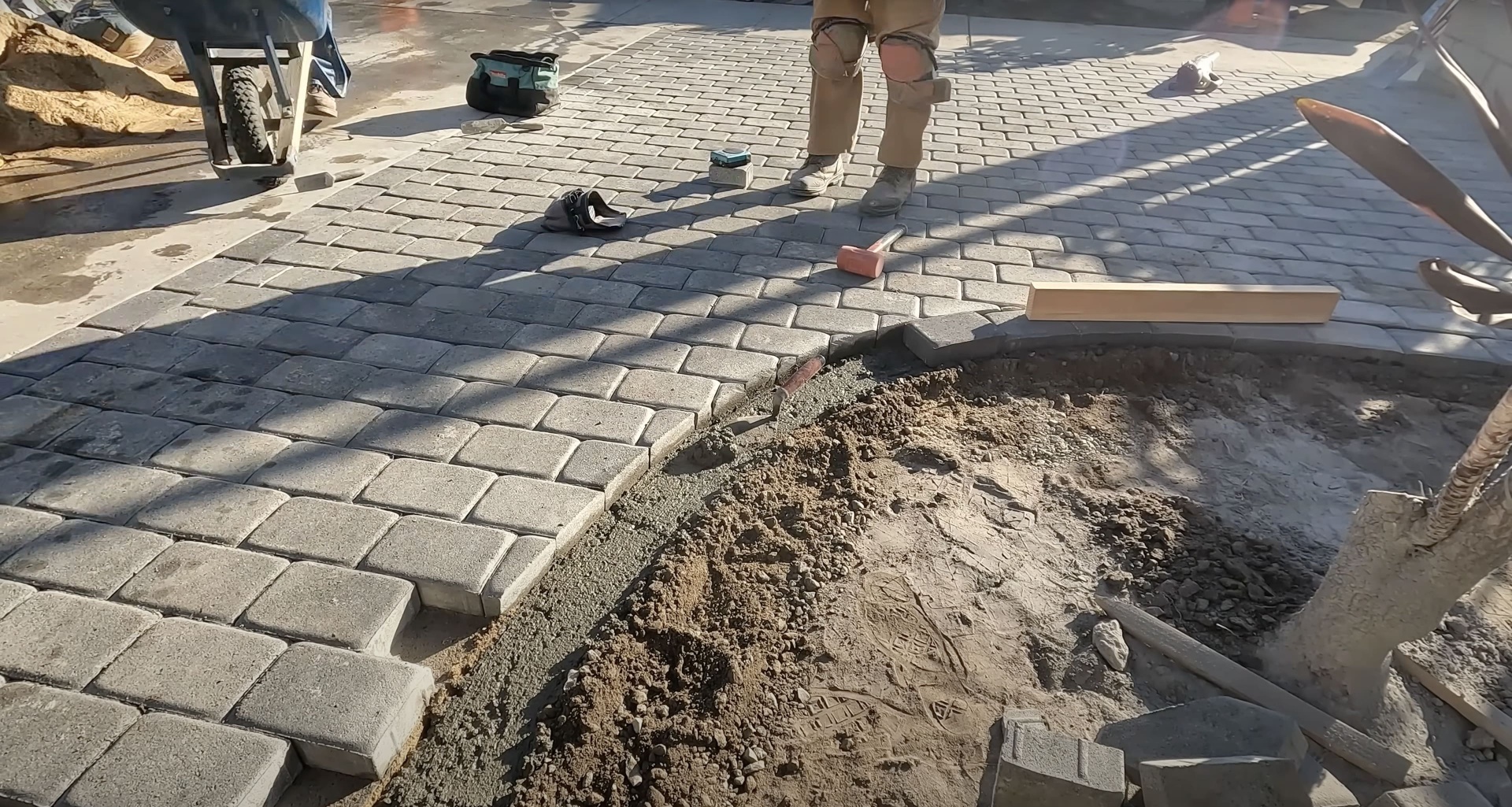 Hudson Concrete Construction installing decorative concrete pavers Concrete paver installation work in progress showing professional craftsmanship