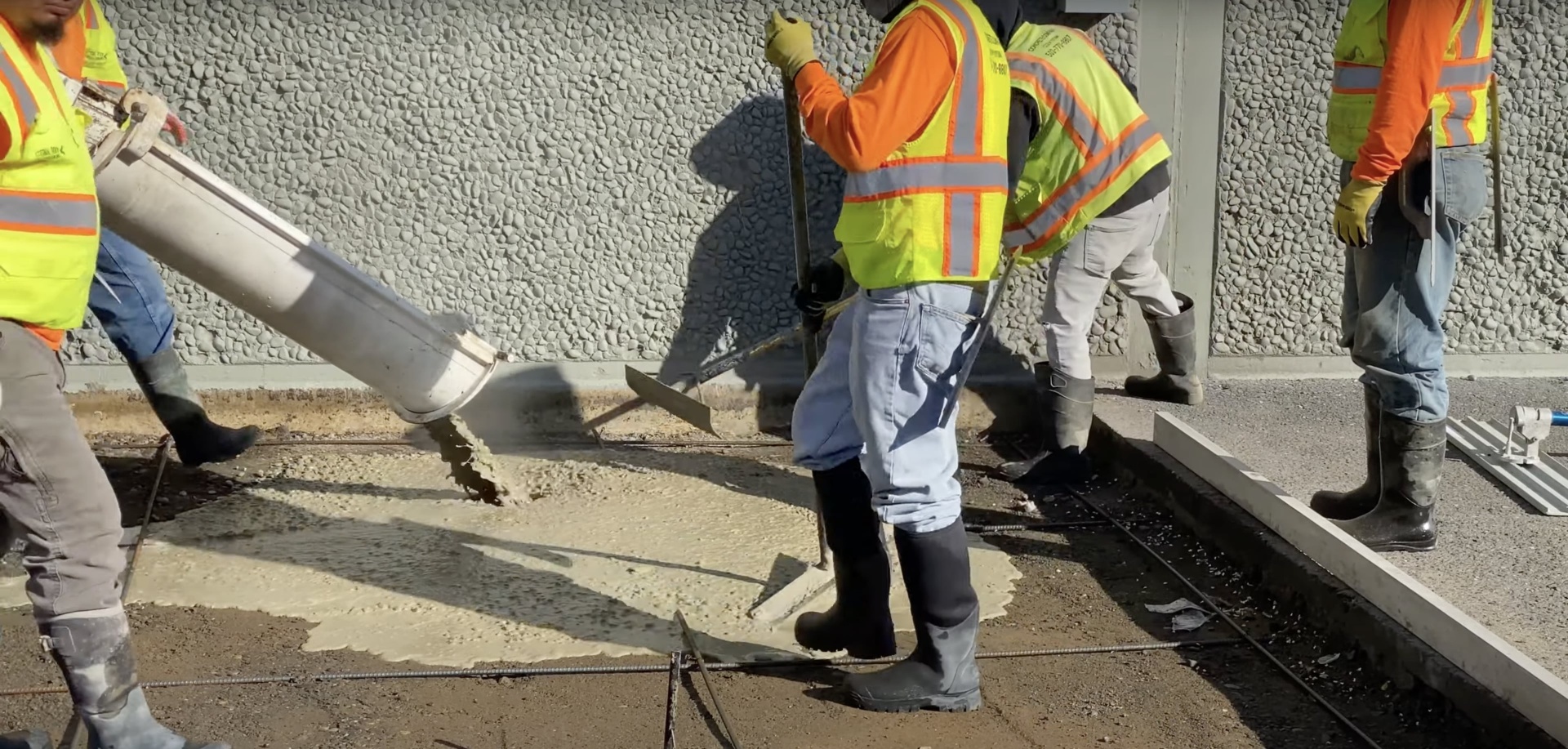 Hudson Concrete Construction team working on major concrete installation Construction crew working on large-scale concrete project with professional equipment