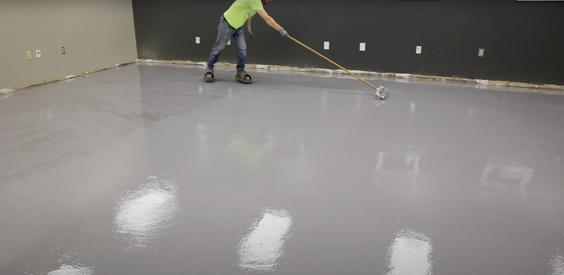 Large-scale commercial concrete flooring project in Hudson, NH Commercial concrete floor installation with professional finishing equipment